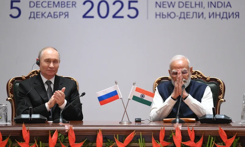 In this pool photograph distributed by the Russian state agency Sputnik, Russia's President Vladimir Putin and India's Prime Minister Narendra Modi attend a plenary session of the India-Russia trade forum in New Delhi on December 5, 2025. (Photo by Grigory SYSOYEV / POOL / AFP via Getty Images) / ***Editor's note : this image is distributed by the Russian state owned agency Sputnik***