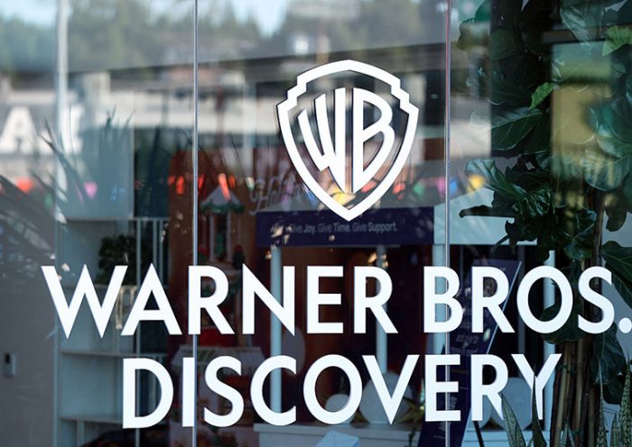 The logo of Warner Bros. Discovery is seen at one of their offices in Culver City, California, on December 5, 2025. (Photo by Patrick T. Fallon / AFP via Getty Images)