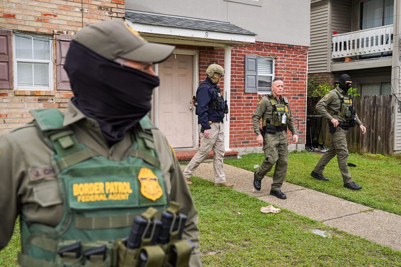 U.S. Chief Border Patrol Agent, Gregory Bovino is seen after knocking on the door of a suspected undocumented immigrant while conducting an immigration enforcement operation in a neighborhood on December 6, 2025 in Kenner, Louisiana. Federal agents are conducting 'Operation Catahoula Crunch,' launched by the Department of Homeland Security as a part of an immigration crackdown on undocumented immigrants in the United States. (Photo by Ryan Murphy/Getty Images)