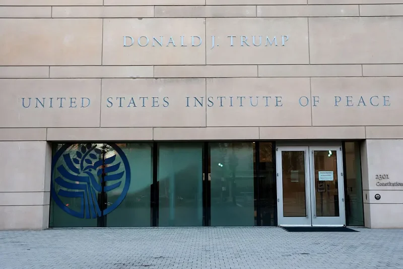 WASHINGTON, DC - DECEMBER 03: U.S. President Donald Trump's name is seen recently placed on the outside of the United States Institute of Peace (USIP) building headquarters on December 03, 2025 in Washington, DC. This addition was made ahead of the Trump administration hosting a deal-signing between the leaders of Rwanda and the Democratic Republic of Congo. (Photo by Anna Moneymaker/Getty Images)