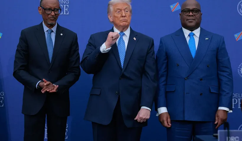 WASHINGTON, DC - DECEMBER 04: U.S. President Donald Trump (C) poses for photographs with Rwandan President Paul Kagame (L) and Democratic Republic of Congo President Felix Tshisekedi after signing a peace accord at the Donald J. Trump Institute of Peace on December 04, 2025 in Washington, DC. As part of his campaign to portray himself as a peacemaker, Trump invited the African leaders to Washington to sign a peace and economic accord which aims to end decades of conflict between the Rwandan and Congolese governments, militias, rebel groups and other warring factions. The peace deal was initially signed in June of 2025 but Rwandan troops remain in the DRC and fighting continues. (Photo by Chip Somodevilla/Getty Images)