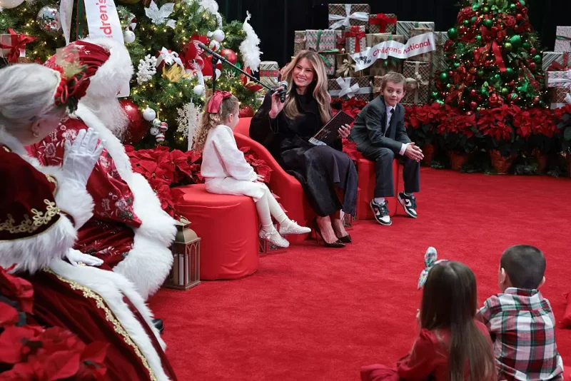 WASHINGTON, DC - DECEMBER 05: First lady Melania Trump visits with patients and their families at Children’s National Hospital on December 5, 2025 in Washington, DC. The first lady visited the hospital to celebrate the winter holiday season and read children’s books to patients. (Photo by Anna Moneymaker/Getty Images)