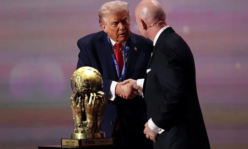 WASHINGTON, DC - DECEMBER 05: U.S. President Donald Trump receives the FIFA Peace Prize from Gianni Infantino, President of FIFA, during the FIFA World Cup 2026 Official Draw at John F. Kennedy Center for the Performing Arts on December 05, 2025 in Washington, DC. (Photo by Patrick Smith/Getty Images)