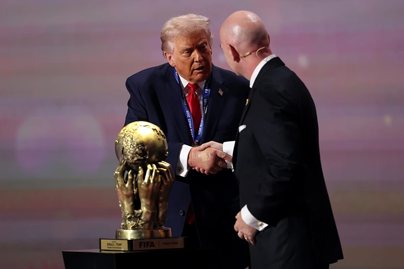 WASHINGTON, DC - DECEMBER 05: U.S. President Donald Trump receives the FIFA Peace Prize from Gianni Infantino, President of FIFA, during the FIFA World Cup 2026 Official Draw at John F. Kennedy Center for the Performing Arts on December 05, 2025 in Washington, DC. (Photo by Patrick Smith/Getty Images)