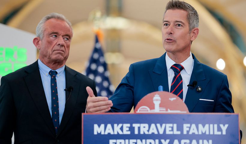 ARLINGTON, VA - DECEMBER 08: U.S. Transportation Secretary Sean P. Duffy (R) speaks alongside Human Services Secretary Robert F. Kennedy Jr. at a conference discussing the launch of the "Make Travel Family Friendly Again" campaign at Ronald Reagan Washington National Airport on December 08, 2025 in Arlington, Virginia. The campaign's focus is to incentivize family-friendly resources at airports. (Photo by Heather Diehl/Getty Images)