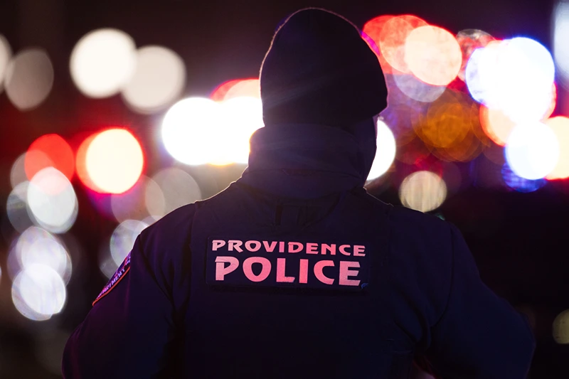 PROVIDENCE, RHODE ISLAND - DECEMBER 13: Police officers remain on the scene on Brown University's campus December 13, 2025 in Providence, Rhode Island. The campus was secured following a shooting as authorities continue investigation. (Photo by Libby O'Neill/Getty Images)