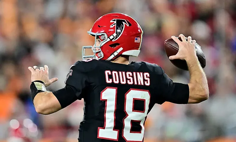 Kirk Cousins #18 of the Atlanta Falcons throws a pass against the Tampa Bay Buccaneers during the fourth quarter at Raymond James Stadium on December 11, 2025 in Tampa, Florida. (Photo by Julio Aguilar/Getty Images)