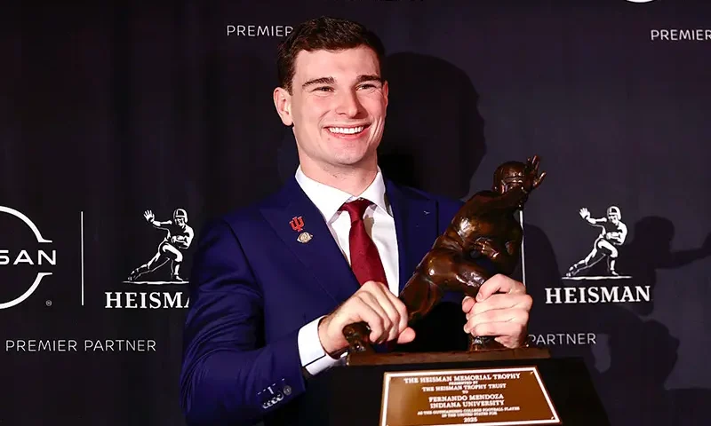 2025 Heisman Trophy winner quarterback Fernando Mendoza of the Indiana Hoosiers poses with The Heisman Memorial Trophy during a news conference at the Marriott Marquis Hotel on December 13, 2025 in New York City. (Photo by Adam Hunger/Getty Images)
