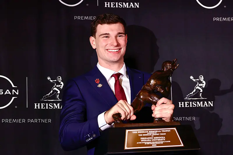 2025 Heisman Trophy winner quarterback Fernando Mendoza of the Indiana Hoosiers poses with The Heisman Memorial Trophy during a news conference at the Marriott Marquis Hotel on December 13, 2025 in New York City. (Photo by Adam Hunger/Getty Images)
