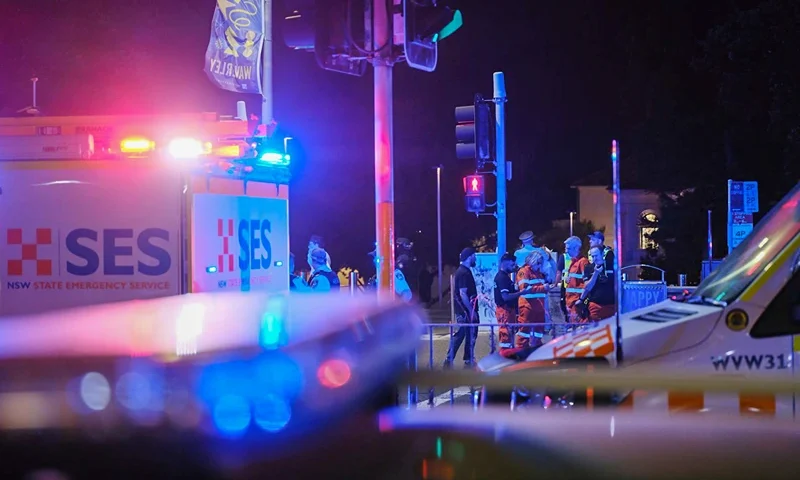 SYDNEY, AUSTRALIA - DECEMBER 14: Police enforce a cordon at Bondi Beach after a mass shooting on December 14, 2025 in Sydney, Australia. Two gunmen dressed in black fired several shots at Sydney's world-famous Bondi Beach, causing at least 10 fatalities and several more casualties, as New South Wales police said the toll was very likely to climb. (Photo by George Chan/Getty Images)