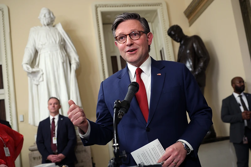 WASHINGTON, DC - DECEMBER 17: U.S. Speaker of the House Mike Johnson (R-LA) speaks to members of the media as he leaves the House Chamber at the U.S. Capitol on December 17, 2025 in Washington, DC. Four Republican Representatives join Democrats to sign a petition forcing a vote on legislation that will extend premium tax credits for the Affordable Care Act. (Photo by Kevin Dietsch/Getty Images)