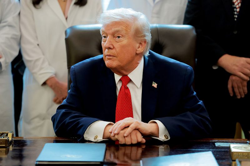 WASHINGTON, DC - DECEMBER 18: U.S. President Donald Trump speaks to journalists after signing an executive order in the Oval Office of the White House on December 18, 2025 in Washington, DC. Trump signed the order reclassifying marijuana as a schedule III drug. (Photo by Anna Moneymaker/Getty Images)