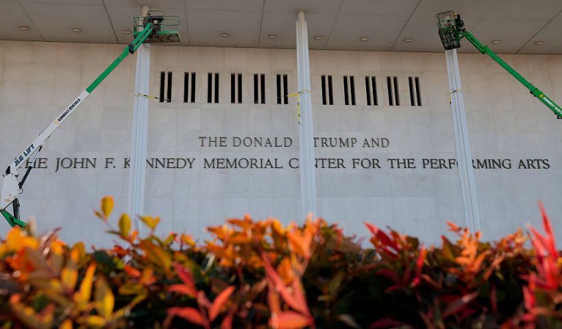 WASHINGTON, DC - DECEMBER 19: Workers adjust the name of the “John F. Kennedy Memorial Center for the Performing Arts" on December 19, 2025 in Washington, DC. The Kennedy Center Board of Trustees voted in what they say was a unanimous decision to rename the facility “The Donald J. Trump and The John F. Kennedy Memorial Center for the Performing Arts”. (Photo by Heather Diehl/Getty Images)