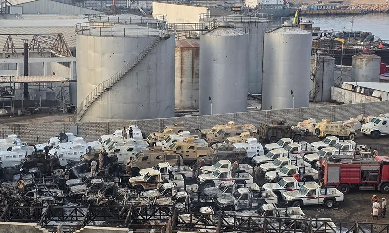A photograph shows damaged military vehicles, reportedly sent by the United Arab Emirates to support Southern Transitional Council (STC) separatist forces, following an air strike carried out by the Saudi-led coalition in the port of Mukalla, southern Yemen, on December 30, 2025. Saudi Arabia on December 30 called the UAE's support for the separatist offensive in Yemen a threat to the kingdom and regional security, hours after a Riyadh-led coalition launched strikes against the Emirati-backed forces. (Photo by AFP via Getty Images)