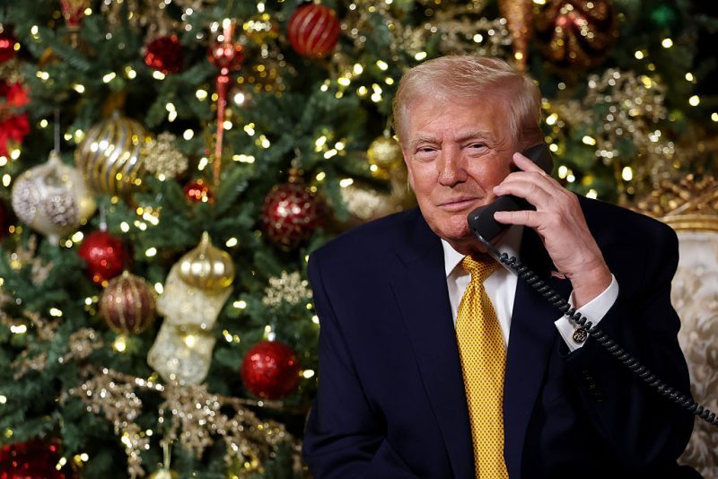 PALM BEACH, FLORIDA - DECEMBER 24: U.S. President Donald Trump calls children as he participates in tracking Santa Claus' movements with the North American Aerospace Defense Command (NORAD) Santa Tracker on Christmas Eve at the Mar-a-Lago resort on December 24, 2025 in Palm Beach, Florida. This is the 70th year that NORAD has publicly tracked Santa’s sleigh on its global rounds. (Photo by Tasos Katopodis/Getty Images)