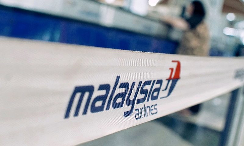 KUALA LUMPUR, MALAYSIA - JANUARY 23: A female passenger is seen as at the ticket counter of Malaysian Airlines at departure terminal of Kuala Lumpur International airport on January 23, 2017 in Sepang, Malaysia. The families of victims onboard the missing flight MH370 said on Sunday they plan to hand deliver a petition and personal letters to Malaysian Transport Minister, Liow Tiong Lai, during his visit to Australia, urging him to resume search for the missing plane after authorities recently announced the international search is suspended. The reputation of Malaysian Airlines remained stained by the flight that went missing in March 2014 while traveling from Kuala Lumpur to Beijing with 239 passengers aboard, 154 were Chinese. (Photo by Rahman Roslan/Getty Images)