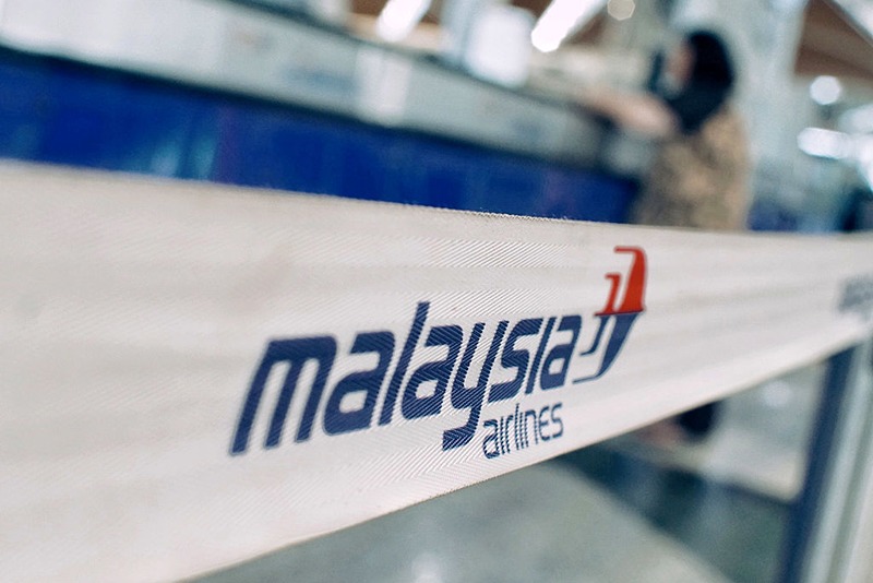 KUALA LUMPUR, MALAYSIA - JANUARY 23: A female passenger is seen as at the ticket counter of Malaysian Airlines at departure terminal of Kuala Lumpur International airport on January 23, 2017 in Sepang, Malaysia. The families of victims onboard the missing flight MH370 said on Sunday they plan to hand deliver a petition and personal letters to Malaysian Transport Minister, Liow Tiong Lai, during his visit to Australia, urging him to resume search for the missing plane after authorities recently announced the international search is suspended. The reputation of Malaysian Airlines remained stained by the flight that went missing in March 2014 while traveling from Kuala Lumpur to Beijing with 239 passengers aboard, 154 were Chinese. (Photo by Rahman Roslan/Getty Images)