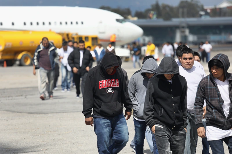 GUATEMALA CITY, GUATEMALA - FEBRUARY 09: Guatemalan immigrants deported from the United States arrive on a ICE deportation flight on February 9, 2017 in Guatemala City, Guatemala. The charter jet, carrying 135 deportees, arrived from Texas, where U.S. border agents catch the largest number illigal immigrants crossing into the United States, many of them from Central America. U.S. President Donald Trump pledged to vastly increase the number of deportations. (Photo by John Moore/Getty Images)