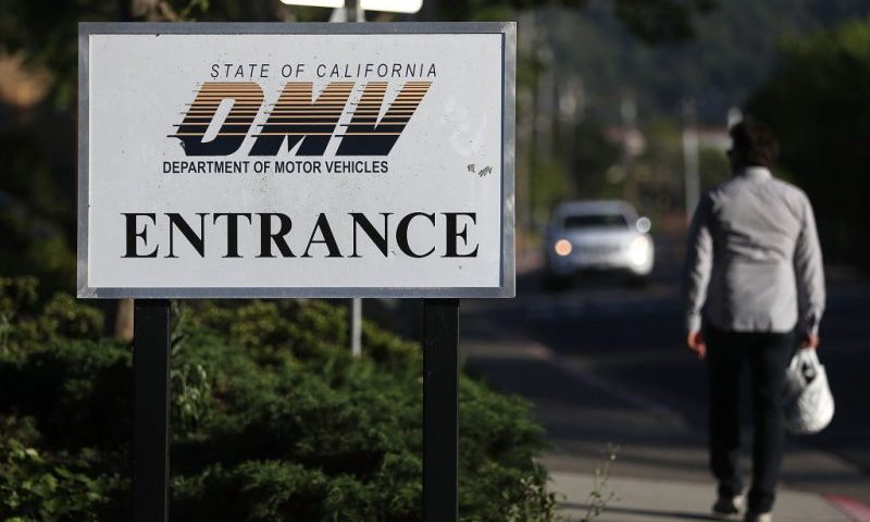 CORTE MADERA, CA - MAY 09: A sign is posted in front of a California Department of Motor Vehicles (DMV) office on May 9, 2017 in Corte Madera, California. The California Department of Motor Vehicles is being accused in a federal lawsuit of violating voter federal "motor voter" law with a requirement for over one million residents who renew their license by mail to fill out a seperate form with their renewal. (Photo by Justin Sullivan/Getty Images)