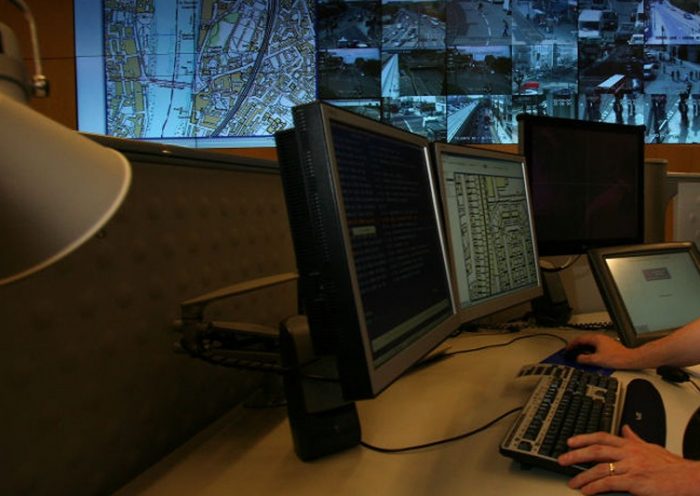 LONDON - APRIL 20: A police officer watches banks of television monitors showing a fraction of London's CCTV camera network in the Metropolitan Police's new Special Operations Room on April 20, 2007 in London, England. The new high tech operations room, believed to be the largest of its kind, is set to be the focal point for the policing of any large event or operation in London and is designed to handle public order events and major incidents, the Special Operations Room will kick off with the policing of this Sunday's London Marathon. (Photo by Matt Cardy/Getty Images)
