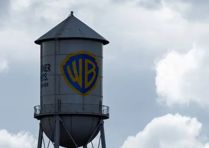 The Warner Bros. studios water tower stands under a stormy sky in Burbank, California, U.S. November 18, 2025. REUTERS/Mike Blake/File Photo