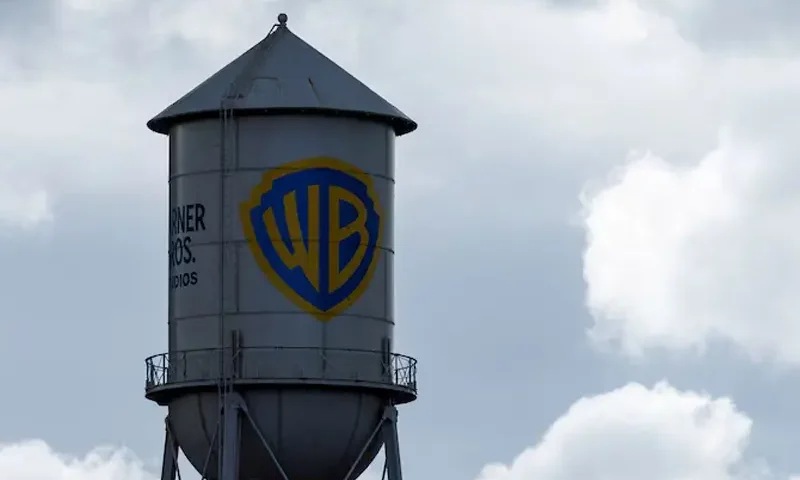 The Warner Bros. studios water tower stands under a stormy sky in Burbank, California, U.S. November 18, 2025. REUTERS/Mike Blake/File Photo