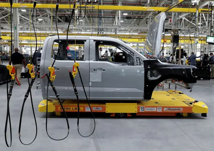 The cab to a Ford all-electric F-150 Lightning truck prototype is seen on an automated guided vehicle (AGV) at the Rouge Electric Vehicle Center in Dearborn, Michigan, U.S. September 16, 2021. REUTERS/Rebecca Cook/File Photo