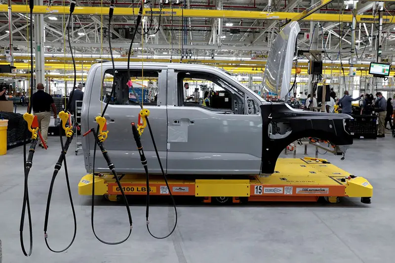 The cab to a Ford all-electric F-150 Lightning truck prototype is seen on an automated guided vehicle (AGV) at the Rouge Electric Vehicle Center in Dearborn, Michigan, U.S. September 16, 2021. REUTERS/Rebecca Cook/File Photo