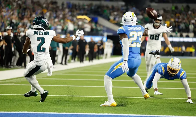 Los Angeles Chargers safety Tony Jefferson (23) intercepts a pass intended for Philadelphia Eagles wide receiver Jahan Dotson (2) during overtime of an NFL football game Monday, Dec. 8, 2025, in Inglewood, Calif. (AP Photo/Caroline Brehman)