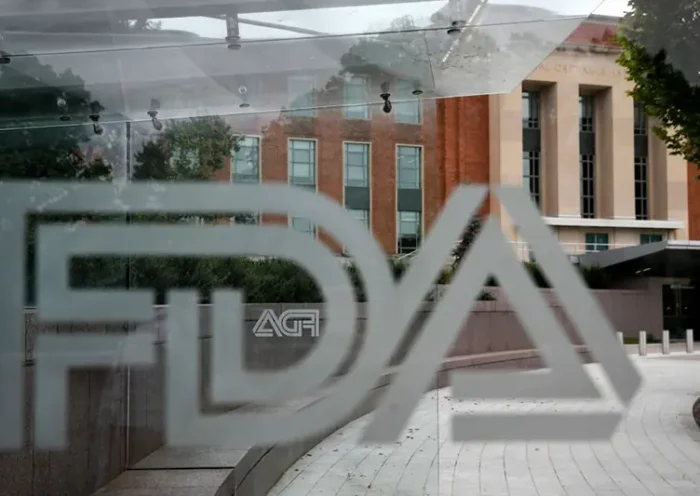 The U.S. Food and Drug Administration building is seen behind FDA logos at a bus stop on the agency’s campus in Silver Spring, Md., Aug. 2, 2018. (AP Photo/Jacquelyn Martin, File)