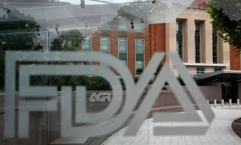 The U.S. Food and Drug Administration building is seen behind FDA logos at a bus stop on the agency’s campus in Silver Spring, Md., Aug. 2, 2018. (AP Photo/Jacquelyn Martin, File)