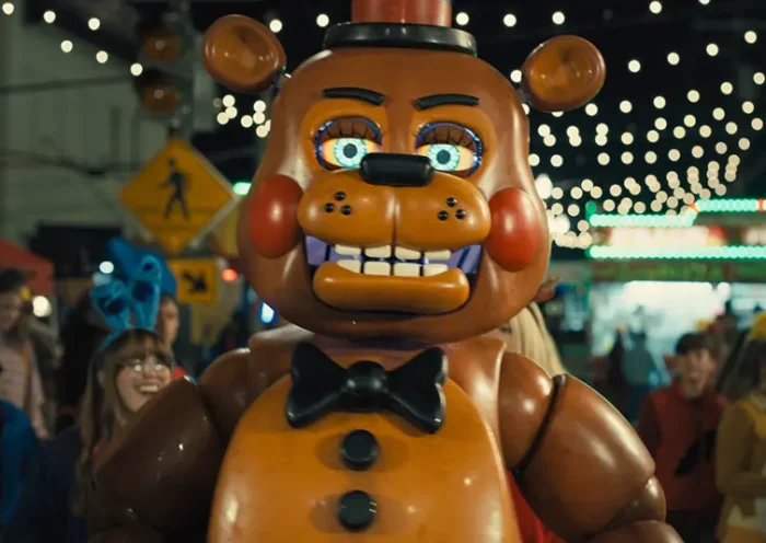 This image released by Universal Pictures shows Toy Freddy, voiced by Kellen Goff, in a scene from “Five Nights at Freddy’s 2.” (Ryan Green/Universal Pictures via AP)