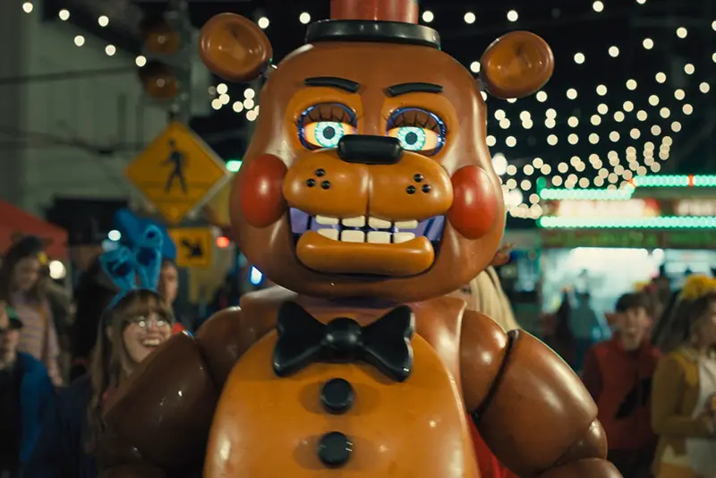 This image released by Universal Pictures shows Toy Freddy, voiced by Kellen Goff, in a scene from “Five Nights at Freddy’s 2.” (Ryan Green/Universal Pictures via AP)