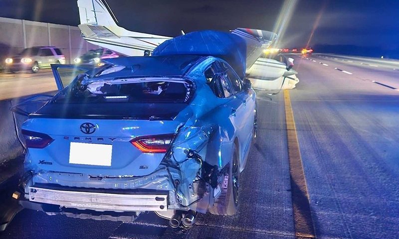 A Toyota Camry is seen wrecked after an aircraft smashes into the vehicle. (Photo: Brevard County Fire Rescue)