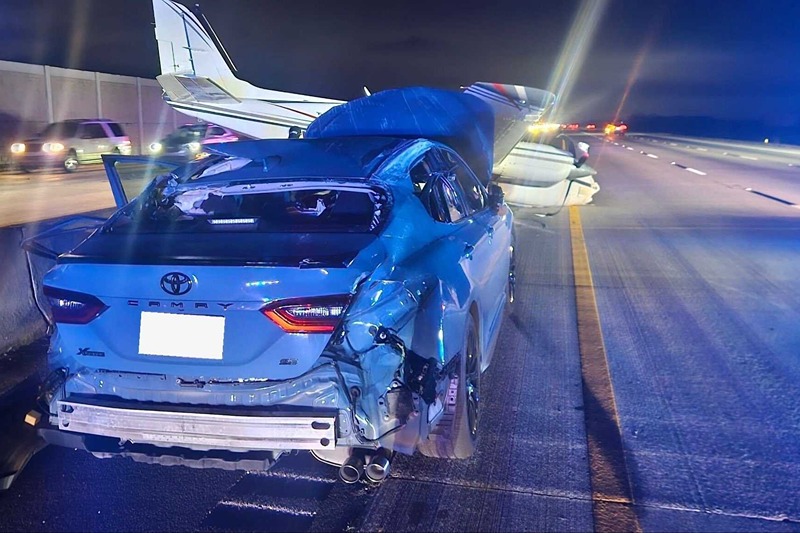 A Toyota Camry is seen wrecked after an aircraft smashes into the vehicle. (Photo: Brevard County Fire Rescue)