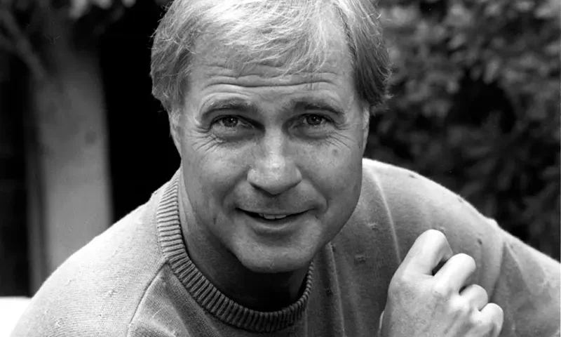 Actor Gil Gerard poses in Los Angeles, Ca. on July 16, 1990. (AP Photo/Reed Saxon, File)
