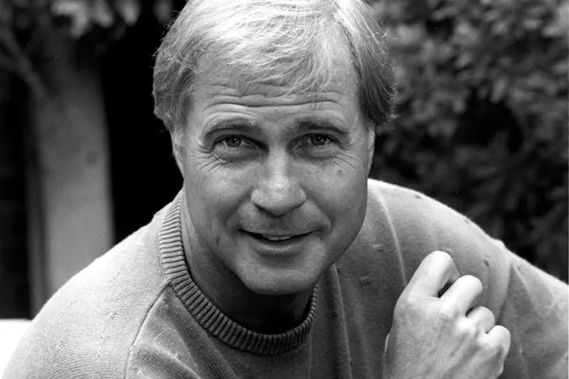 Actor Gil Gerard poses in Los Angeles, Ca. on July 16, 1990. (AP Photo/Reed Saxon, File)
