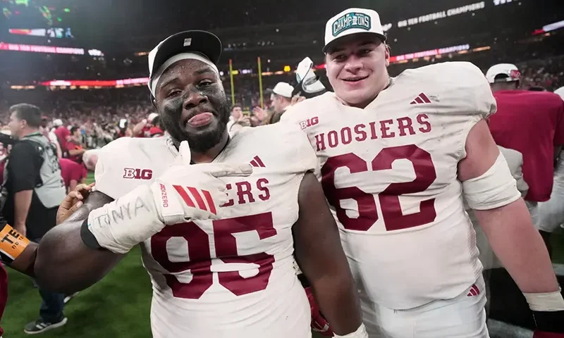 Indiana’s Tyrique Tucker and Drew Evans celebrate after the Big Ten championship NCAA college football game against Ohio State in Indianapolis, Saturday, Dec. 6, 2025. (AP Photo/AJ Mast)
