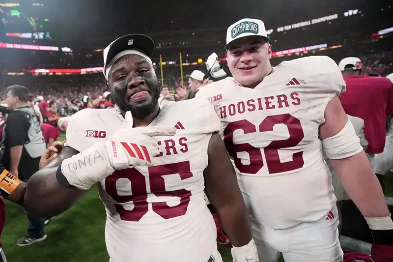 Indiana’s Tyrique Tucker and Drew Evans celebrate after the Big Ten championship NCAA college football game against Ohio State in Indianapolis, Saturday, Dec. 6, 2025. (AP Photo/AJ Mast)