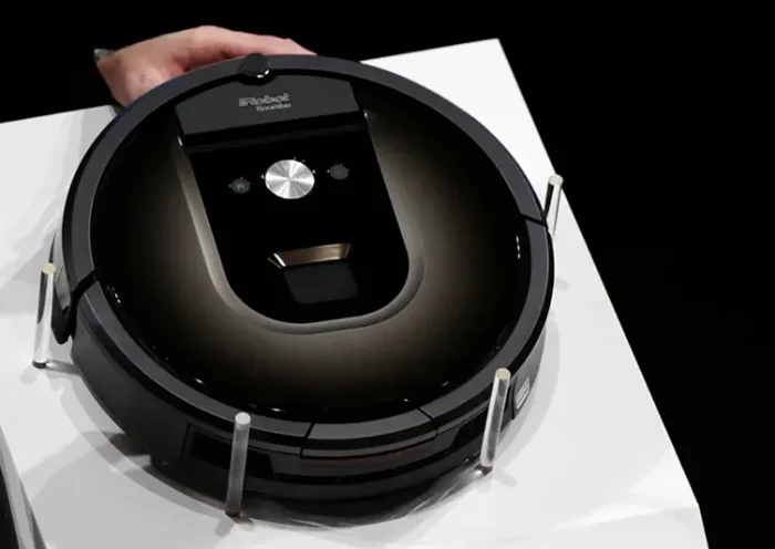 A Roomba 980 vacuum cleaning robot is presented during a presentation in Tokyo, on Sept. 29, 2015. (AP Photo/Eugene Hoshiko, File)