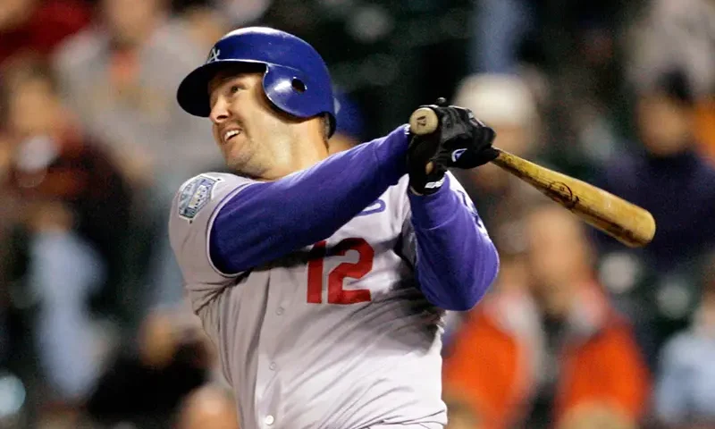 Los Angeles Dodgers Jeff Kent hits a two-run home run against the San Francisco Giants in the fourth inning of a baseball game in San Francisco, Sept. 26, 2008. (AP Photo/Jeff Chiu, File)