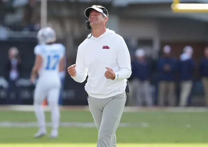 Mississippi head coach Lane Kiffin reacts to a official’s call during the second half of an NCAA college football game against Mississippi State, Friday, Nov. 28, 2025, in Starkville, Miss. (AP Photo/Rogelio V. Solis)