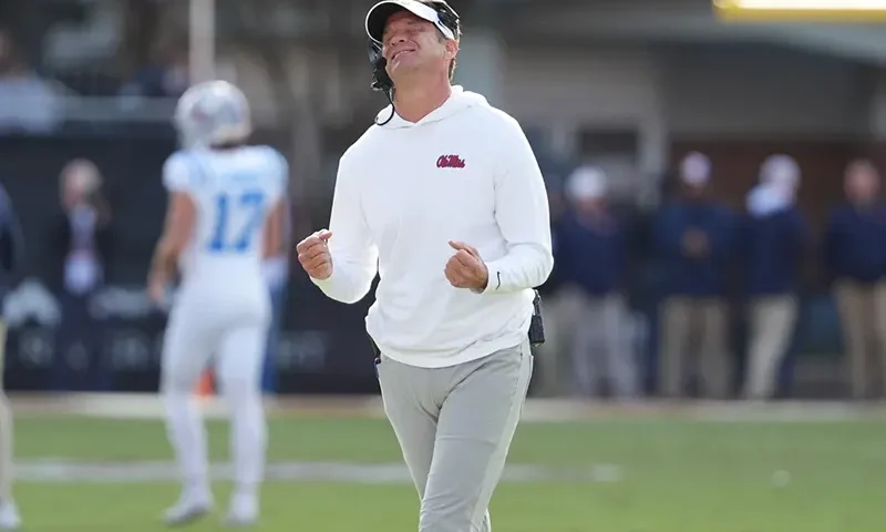 Mississippi head coach Lane Kiffin reacts to a official’s call during the second half of an NCAA college football game against Mississippi State, Friday, Nov. 28, 2025, in Starkville, Miss. (AP Photo/Rogelio V. Solis)