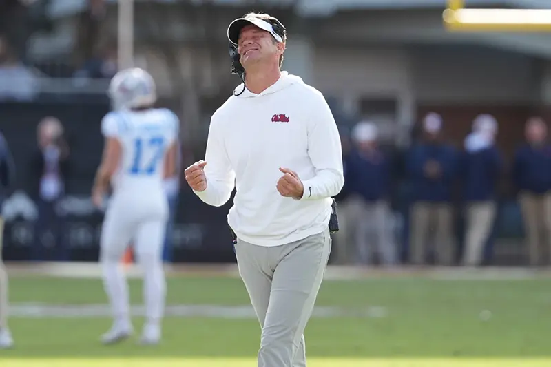 Mississippi head coach Lane Kiffin reacts to a official’s call during the second half of an NCAA college football game against Mississippi State, Friday, Nov. 28, 2025, in Starkville, Miss. (AP Photo/Rogelio V. Solis)