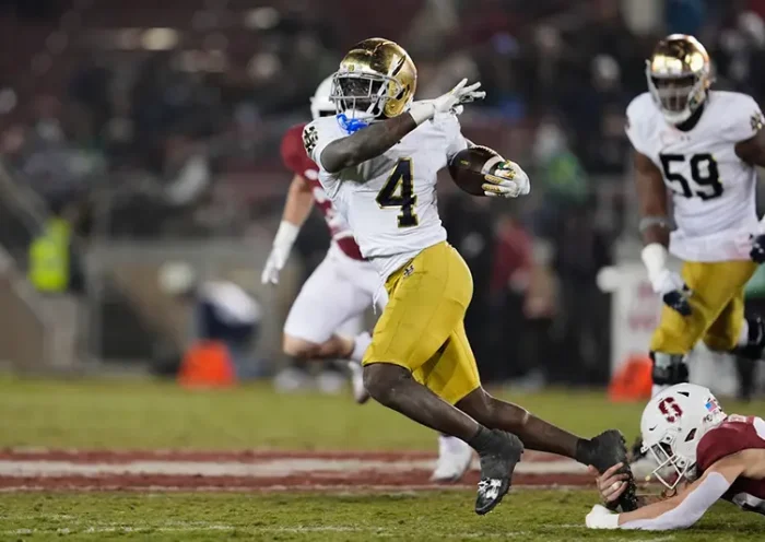 Notre Dame running back Jeremiyah Love (4) is tackled by Stanford safety Charlie Eckhardt (39) during the second half of an NCAA college football game, Saturday, Nov. 29, 2025, in Stanford, Calif. (AP Photo/Godofredo A. Vásquez)