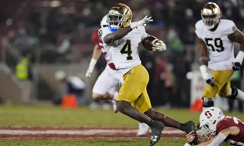 Notre Dame running back Jeremiyah Love (4) is tackled by Stanford safety Charlie Eckhardt (39) during the second half of an NCAA college football game, Saturday, Nov. 29, 2025, in Stanford, Calif. (AP Photo/Godofredo A. Vásquez)