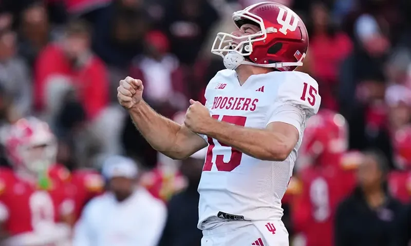 Indiana quarterback Fernando Mendoza (15) celebrates after throwing a touchdown pass to wide receiver Omar Cooper Jr. during the first half of an NCAA college football game against Maryland, Saturday, Nov. 1, 2025, in College Park, Md. (AP Photo/Stephanie Scarbrough, File)