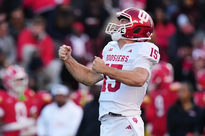 Indiana quarterback Fernando Mendoza (15) celebrates after throwing a touchdown pass to wide receiver Omar Cooper Jr. during the first half of an NCAA college football game against Maryland, Saturday, Nov. 1, 2025, in College Park, Md. (AP Photo/Stephanie Scarbrough, File)