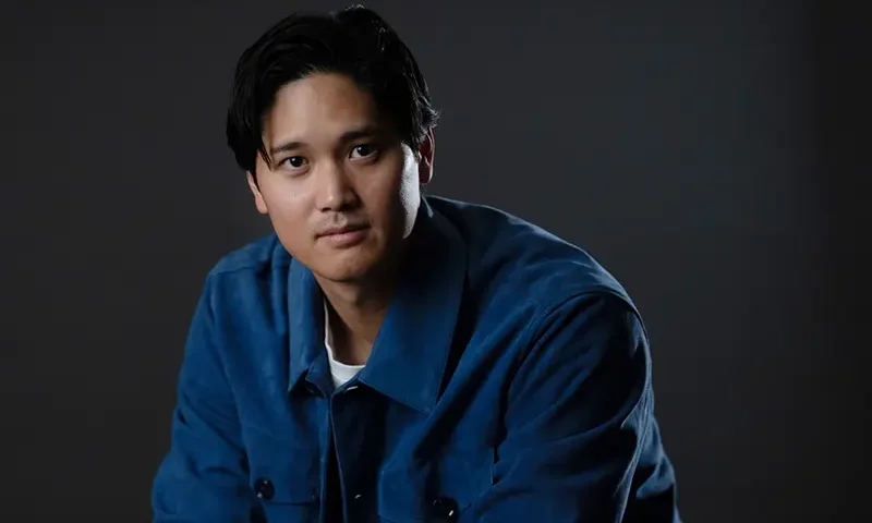 Los Angeles Dodgers’ Shohei Ohtani poses for photos after an interview with The Associated Press in Pasadena, Calif., Wednesday, Nov. 26, 2025. (AP Photo/Jae C. Hong)