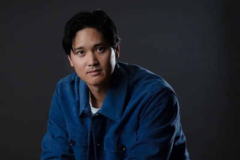 Los Angeles Dodgers’ Shohei Ohtani poses for photos after an interview with The Associated Press in Pasadena, Calif., Wednesday, Nov. 26, 2025. (AP Photo/Jae C. Hong)
